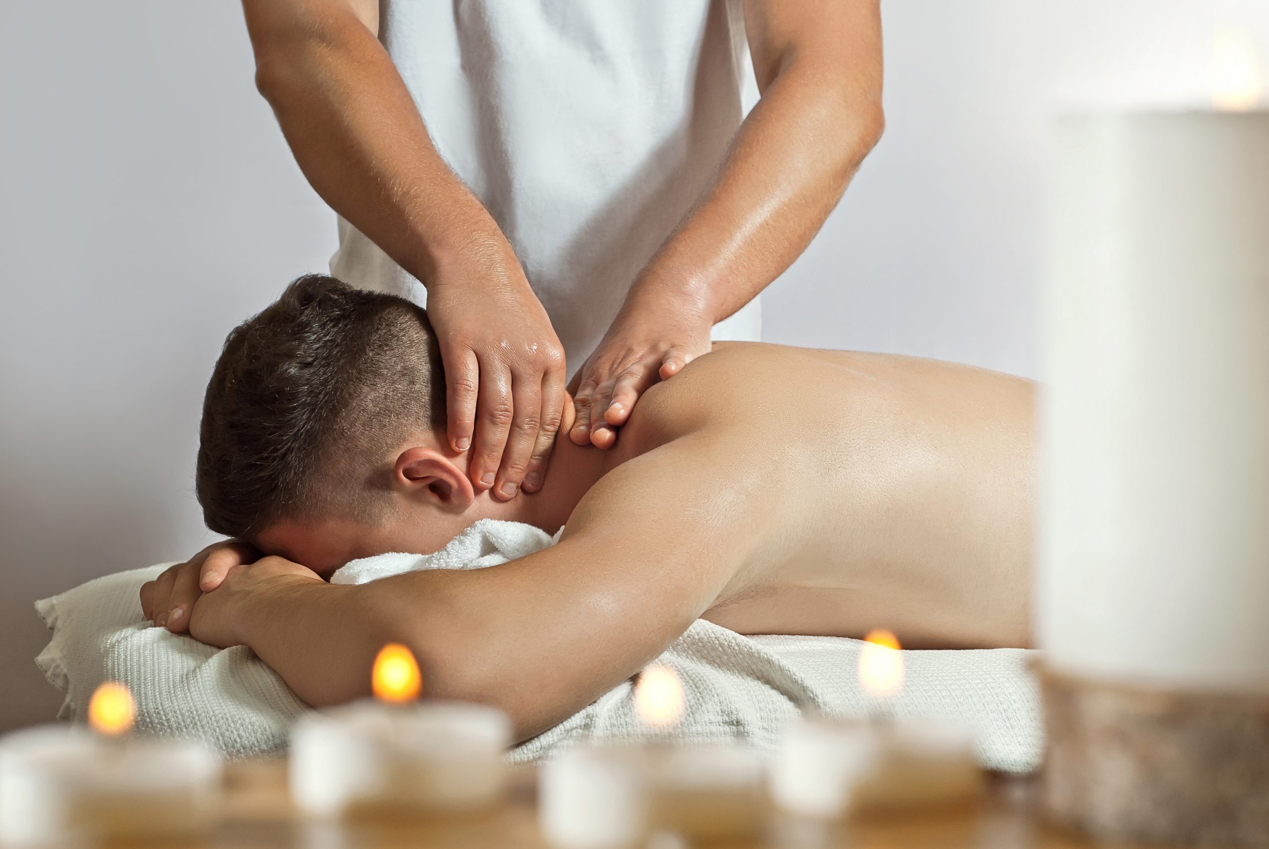 candles and a neck massage