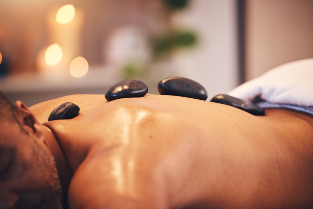 Man having hot stone massage.